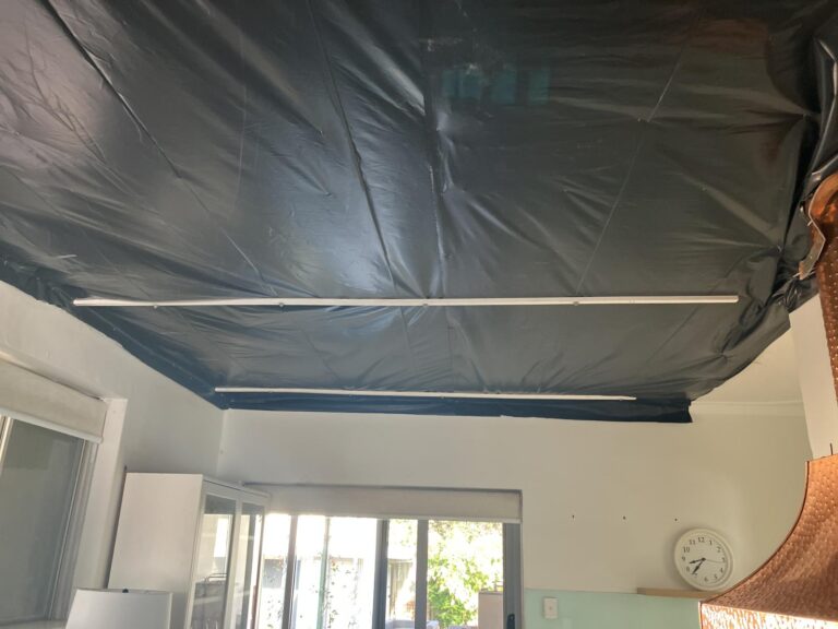 Temporary repairs on a storm damaged house
