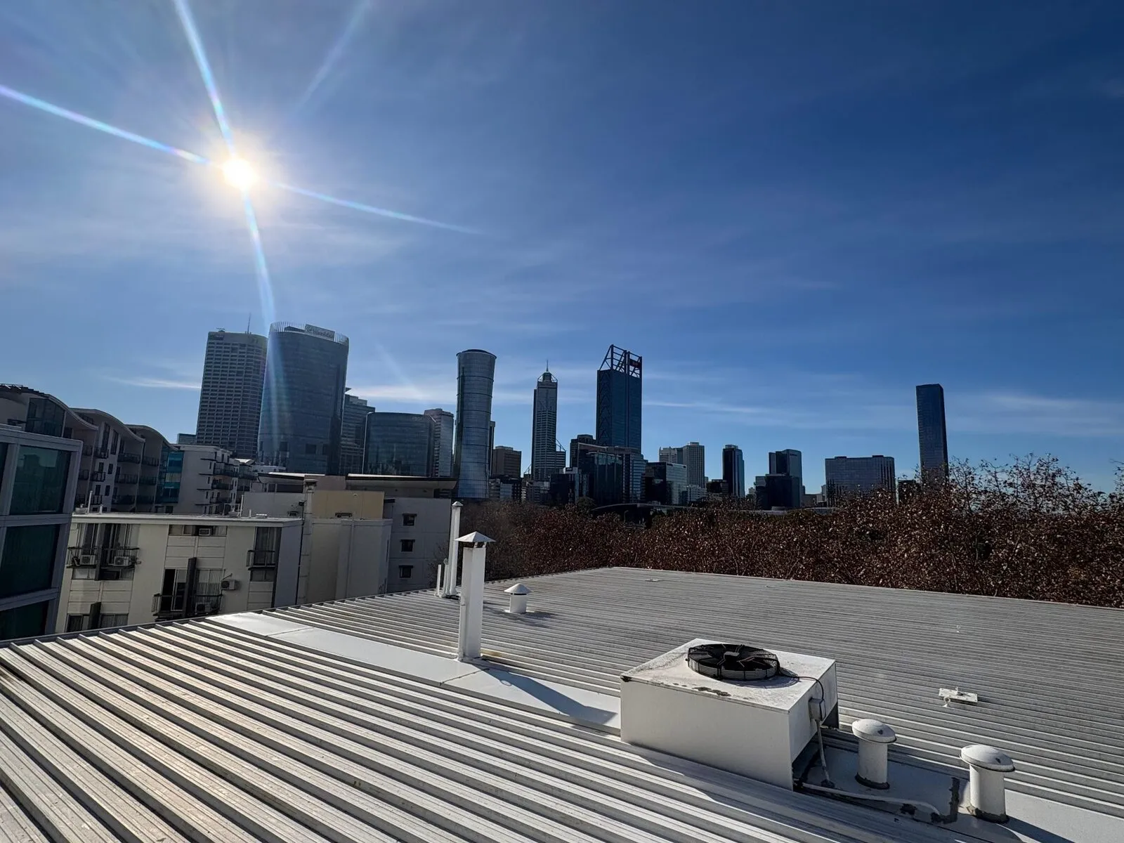 Perth city skyline seen from a commercial metal roof